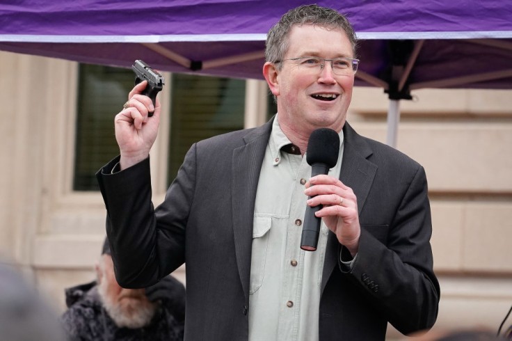Fathers of School Shooting Victims Blast Rep. Thomas Massie for 'Nasty' Christmas Family Photo