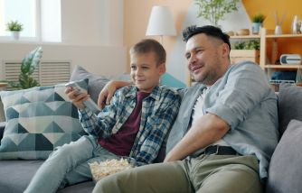 Father and Son Watching TV Together